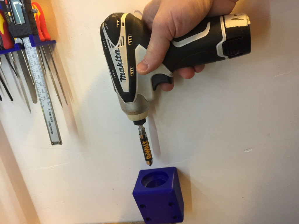 Wall-mounted holder for Makita 12v impact wrench
