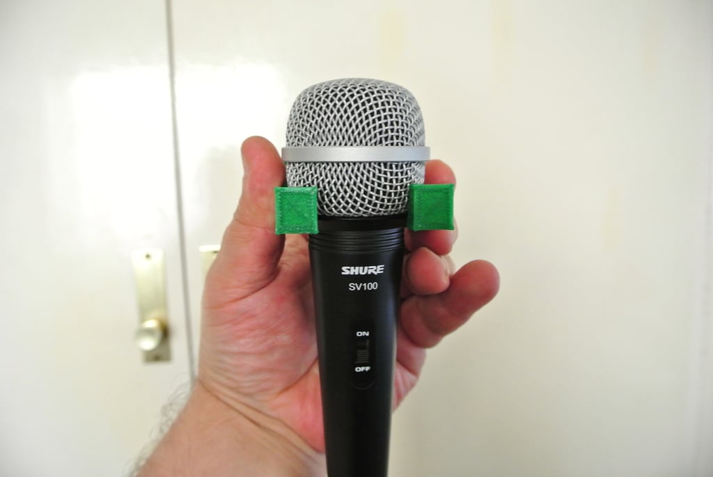 Wall mounted holder for Shure SV100 microphone