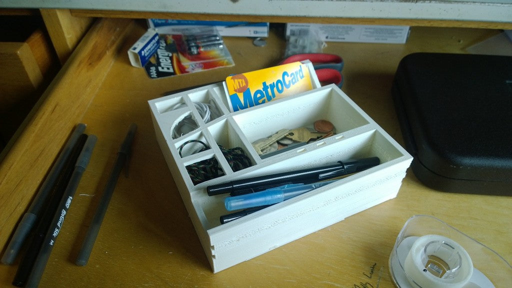Desk organizer with space for credit cards, pens, headphones and keys