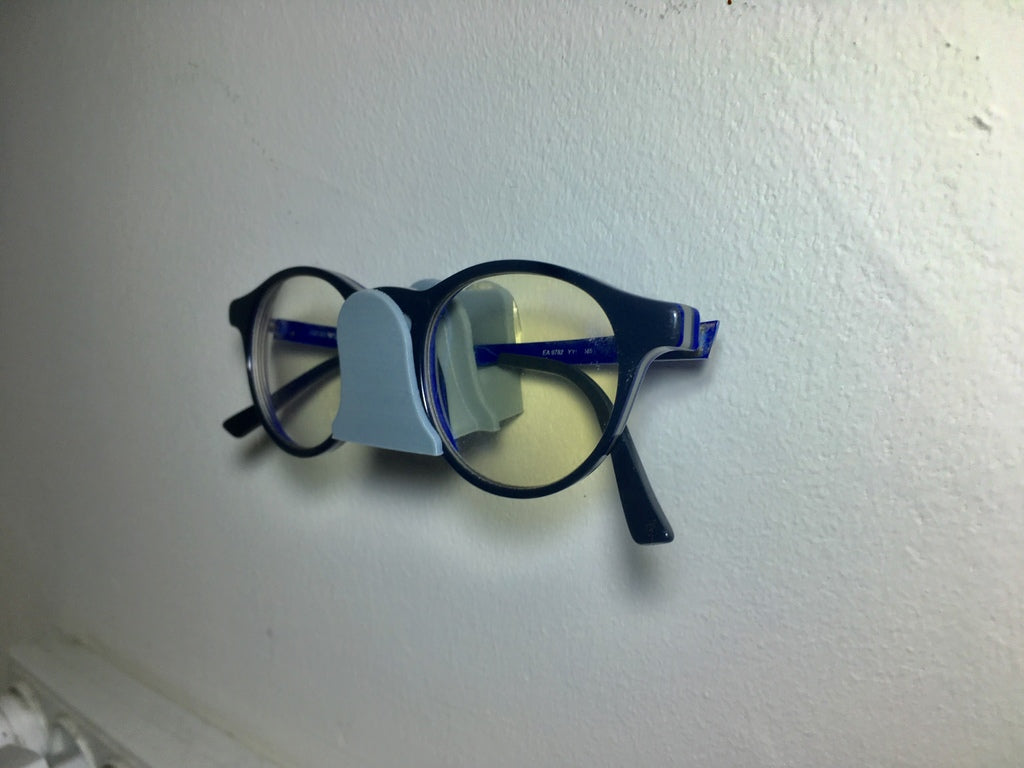 Wall-mounted holder for glasses