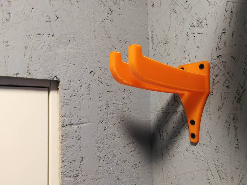 Roller ski holder for wall mounting