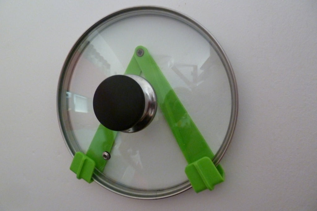 Adjustable pot lid holder for the kitchen wall