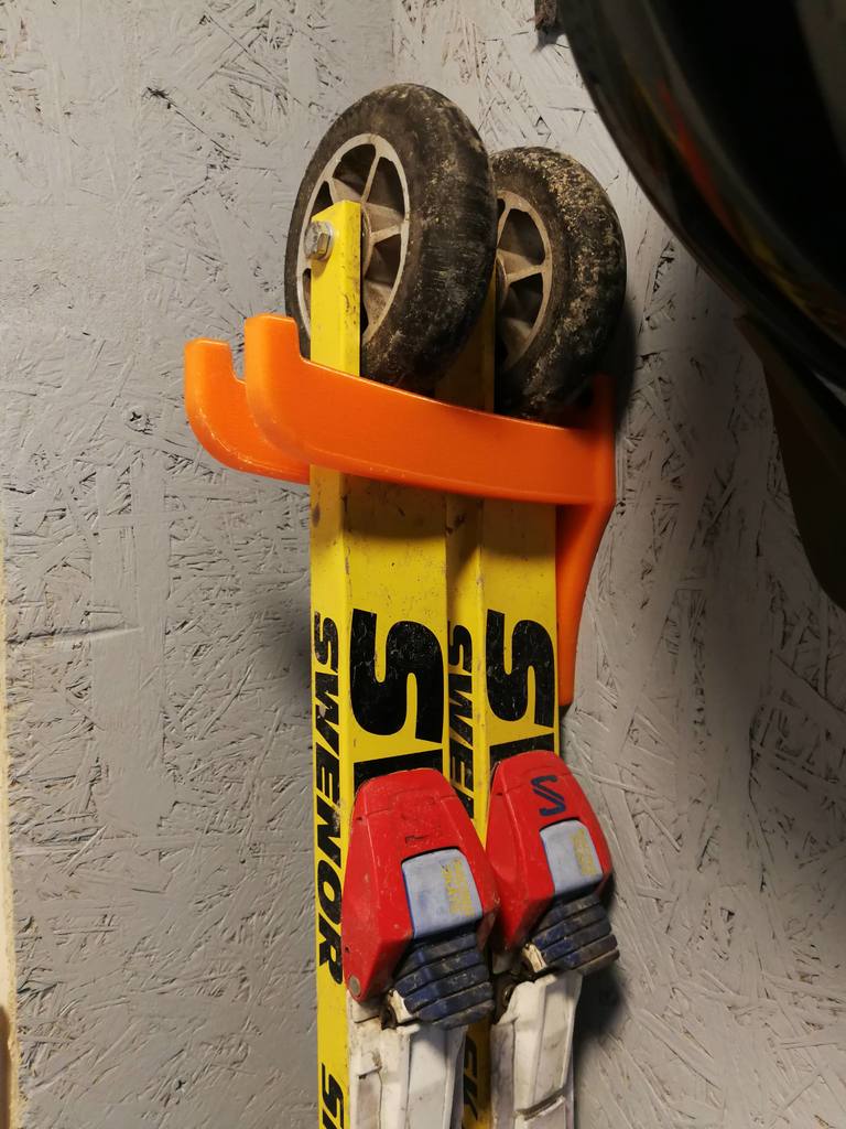 Roller ski holder for wall mounting