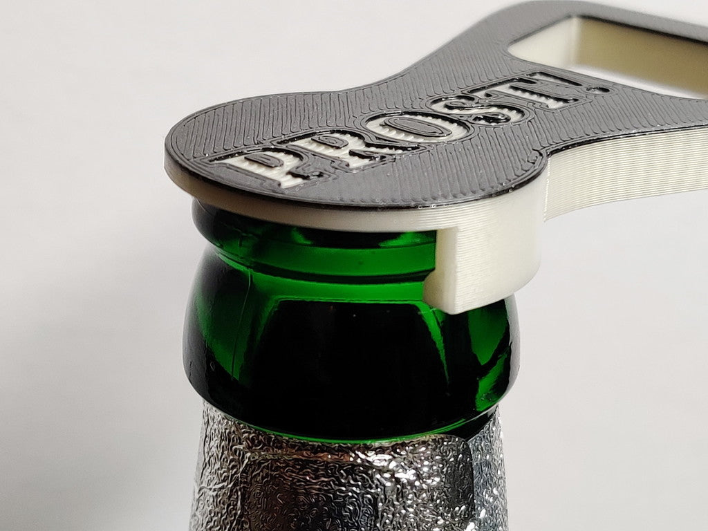 Bottle opener and lid combination with texts in 9 different languages