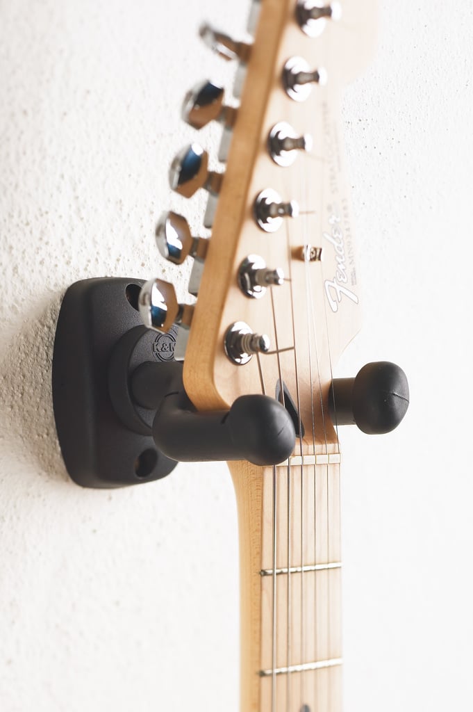 Universal wall mount for guitar with gravity hold and moving parts