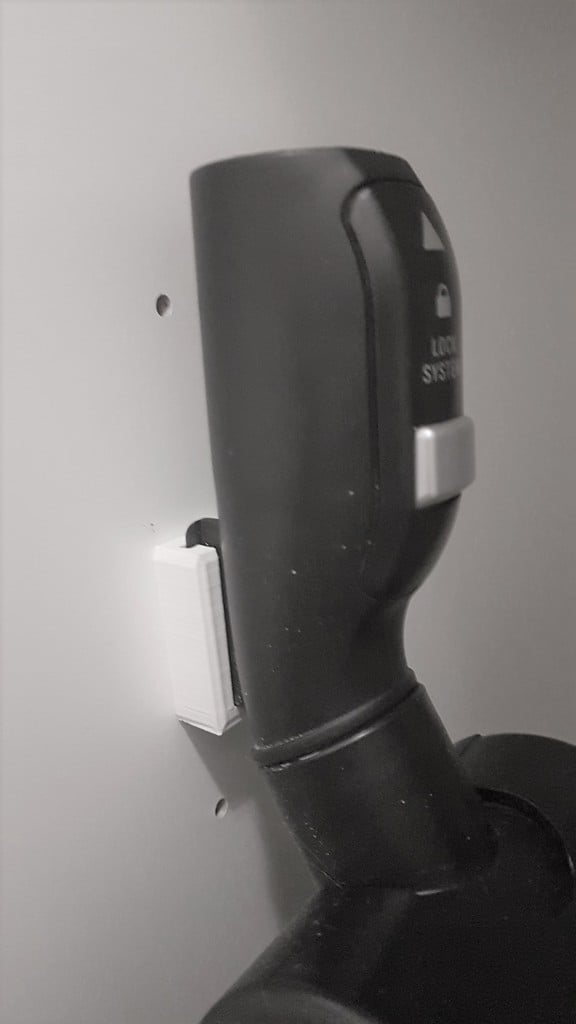 Wall mounting for vacuum cleaner accessories