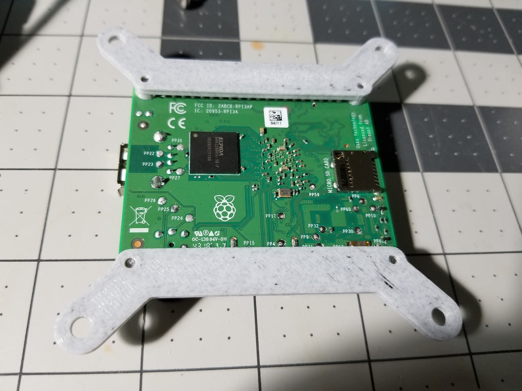 Minimalistic Raspberry Pi VESA mounting bracket at 75mm - Also works with Odroid C4 and other single board computers