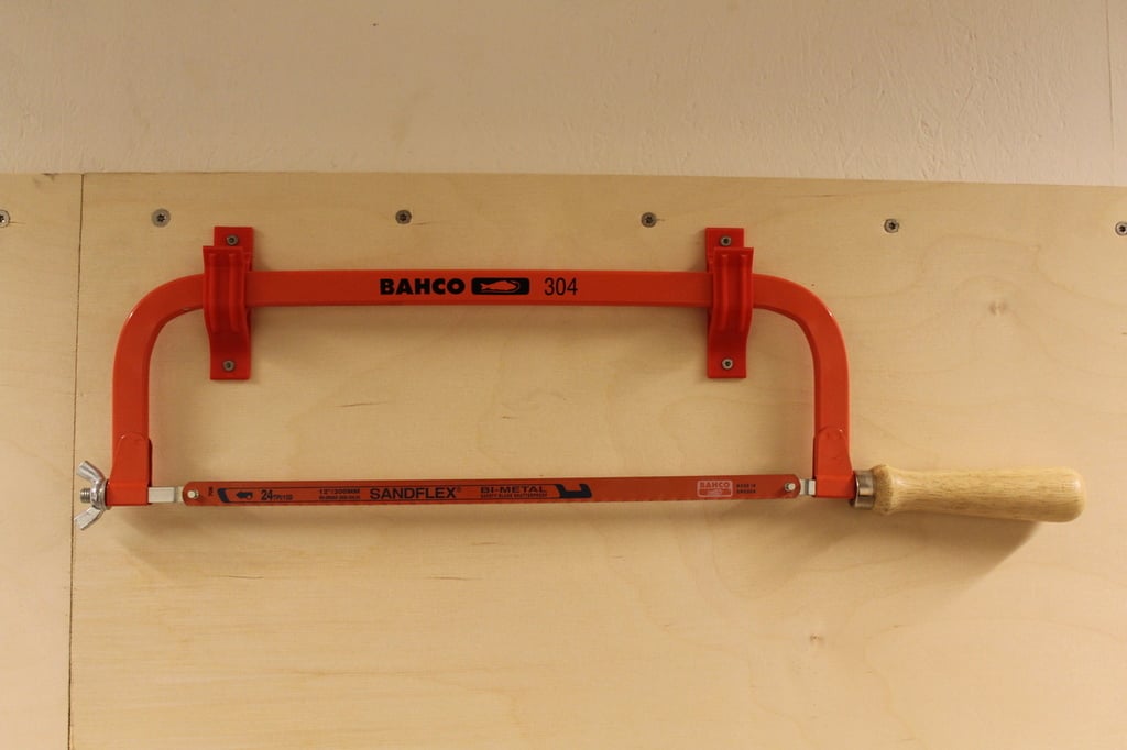 Wall-mounted holder for Hacksaw