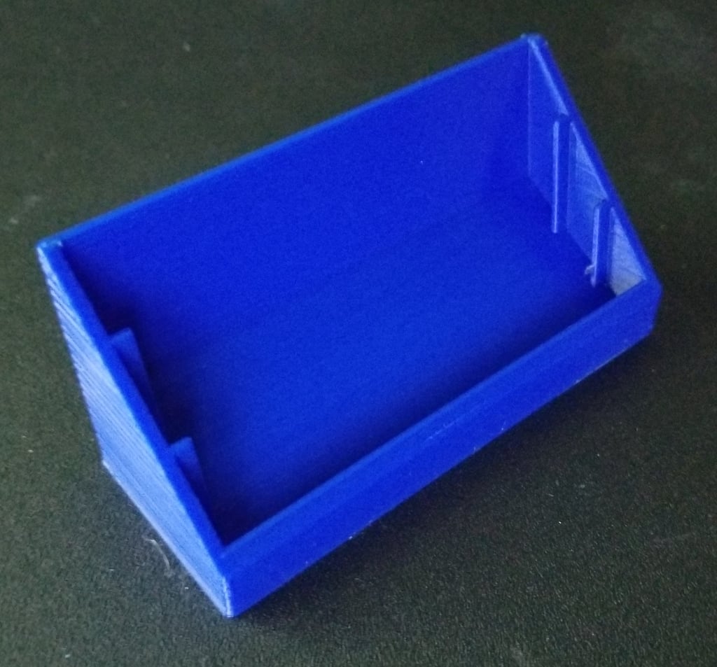 Desk holder for business cards with slope and divisions