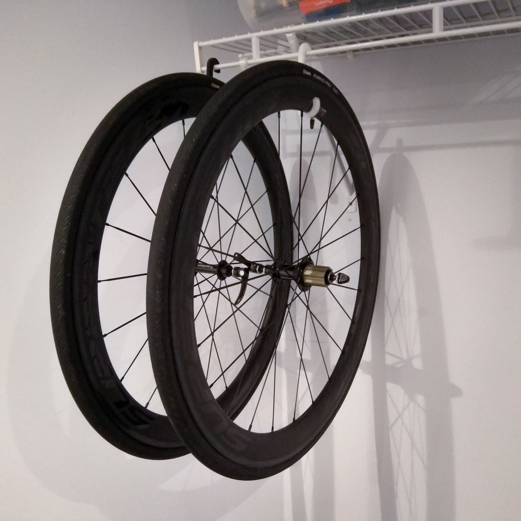 Storage hook for bicycle wheels