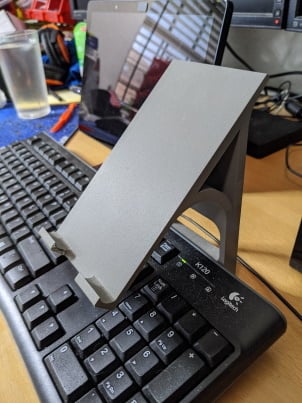 Phone holder above keyboard