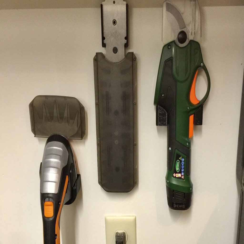 Wall mounted tool holders for Scotts Power Pruner and Worx 8&quot; Trimmer