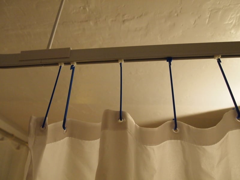 Adjustable length hook for shower curtain