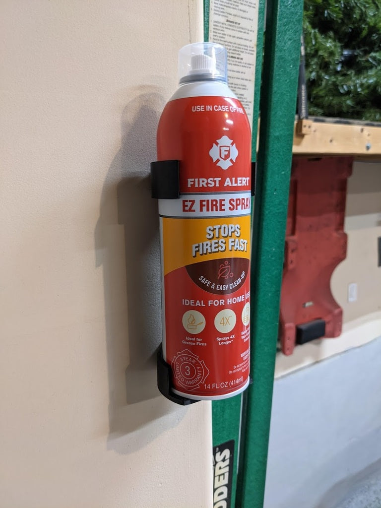 Wall-mounted holder for First Alert fire spray