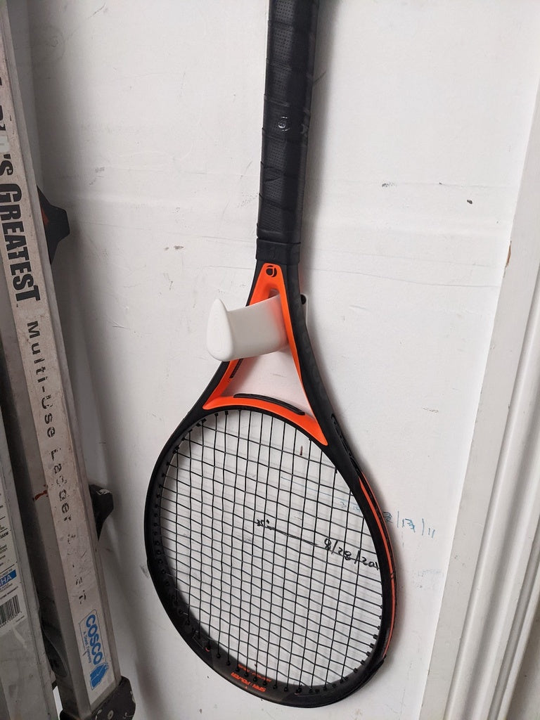 Wall-mounted tennis racket holder