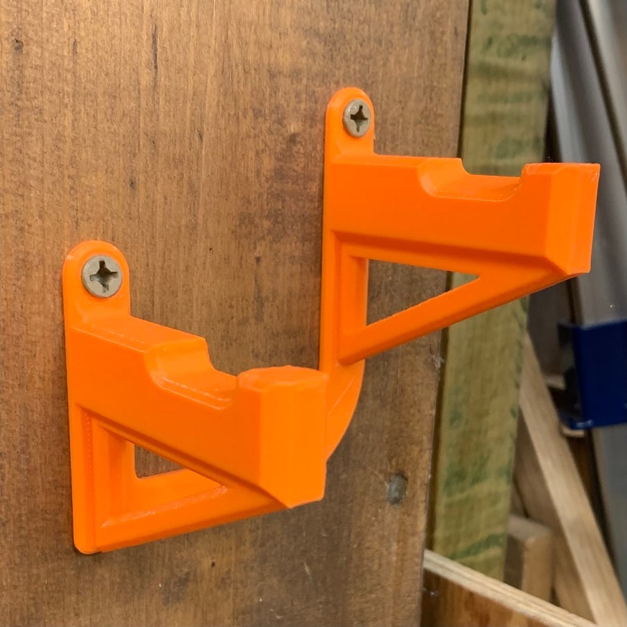 Wall mounted holder for cordless tools