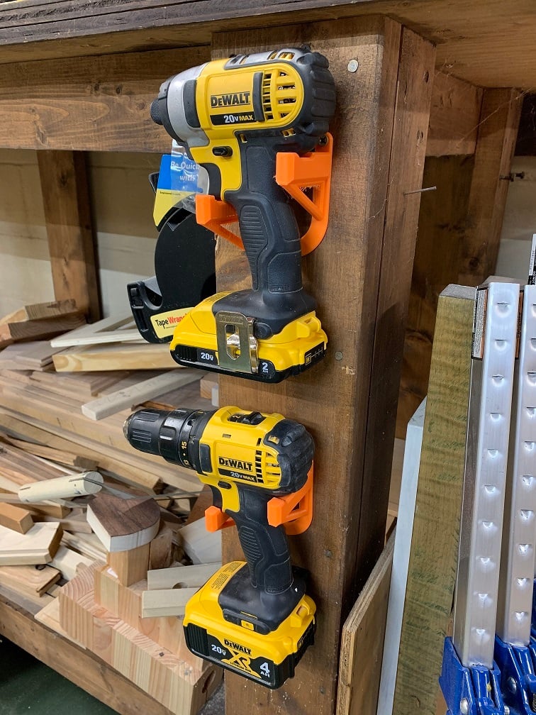Wall mounted holder for cordless tools