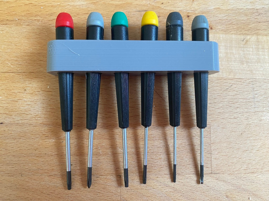 Wall-mounted screwdriver holder