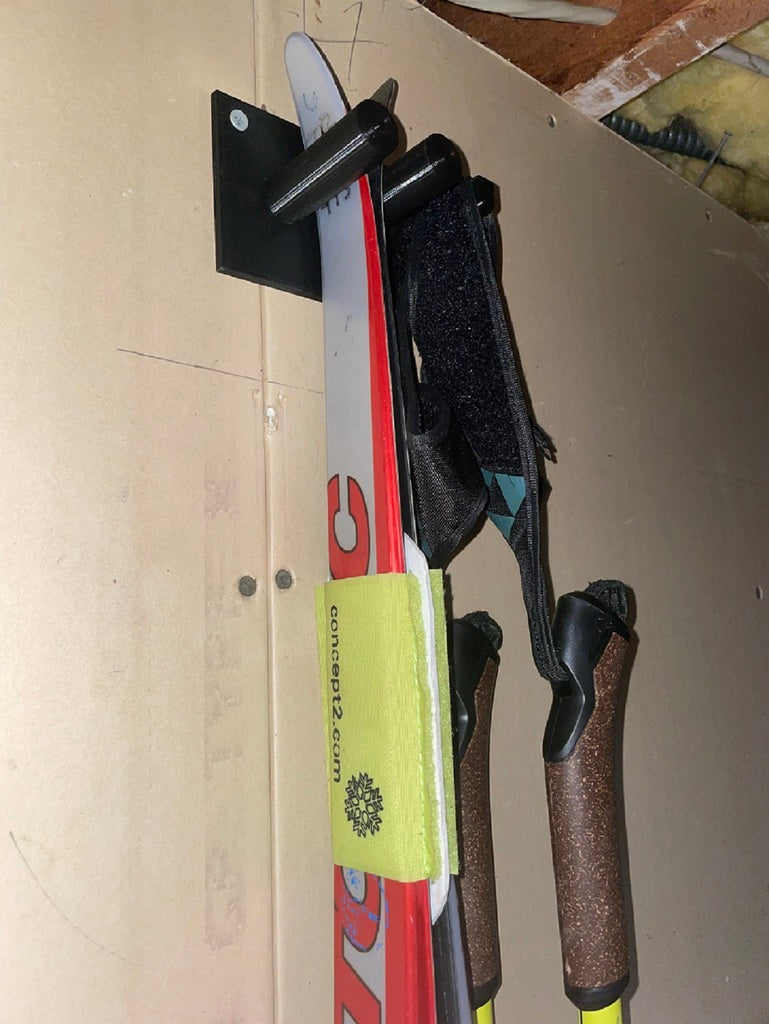 Wall-mounted holder for Nordic skis and poles