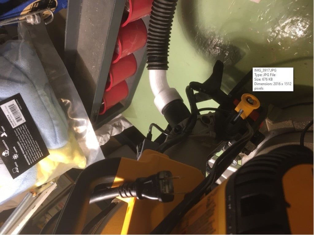 Vacuum cleaner hose connects to Dewalt DWS713 Miter Saw