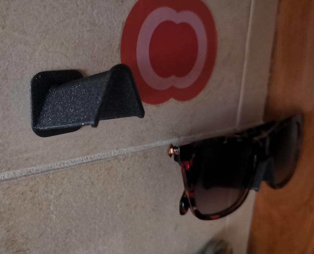 Sunglasses holder for wall mounting